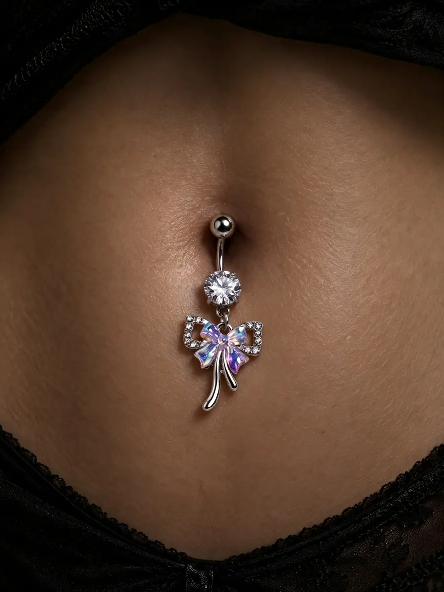 Iridescent Bow Belly Button Ring, 14G Rhinestone Navel Piercing, Stainless Steel Dangle Body Jewelry for Women - wearing view